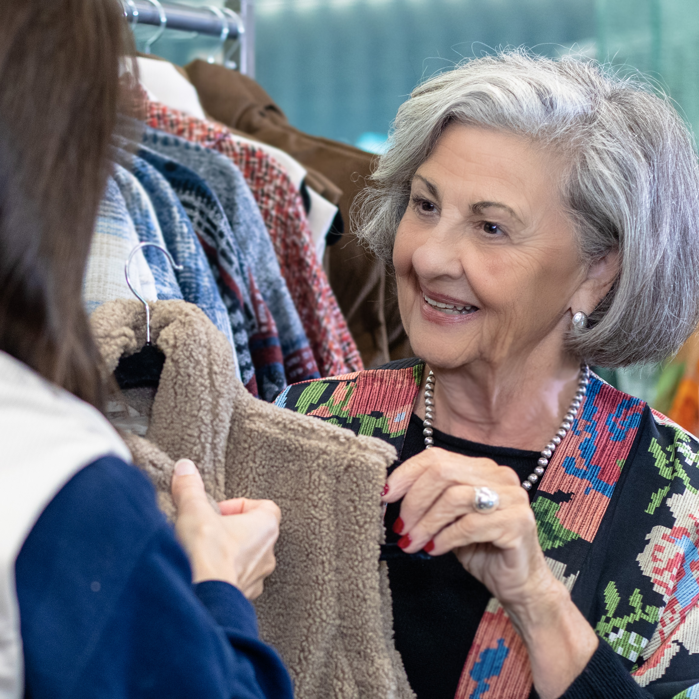 Chris helping a shopper at Friend to Friend Mission Bay Boutique